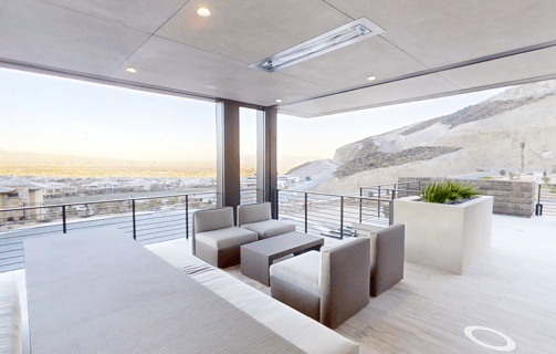 a patio with a couch and a table