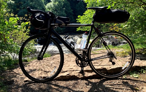 Bike with full kit by the waterfall