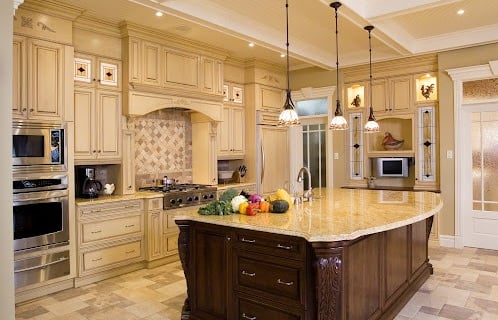 Luxury kitchen remodel in Buckeye AZ featuring white quartz island and pendant lighting