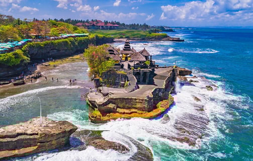 a beach with a view of a beach and a cliff