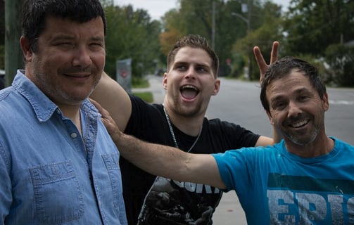 a group of men standing outside jericho road ministries