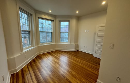 a room with a wooden floor and a wooden floor