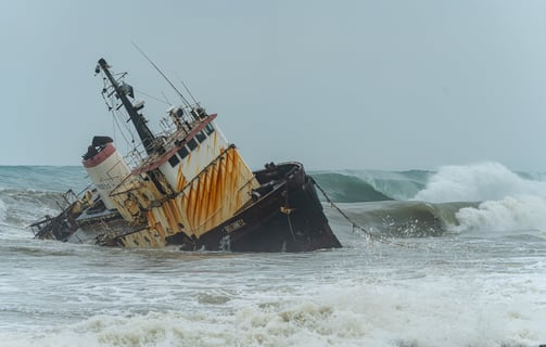 Shipwreck with 2 perfect waves rolling on the back