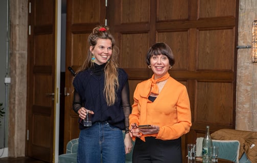 Two confident women, public speaking coaches, at workshop
