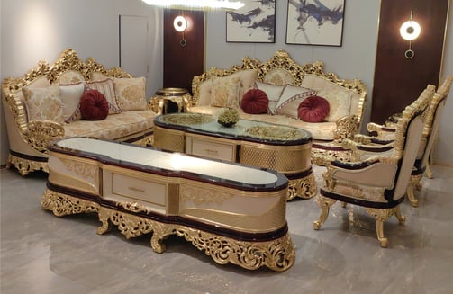 a luxury living room with a solid wood carving couch and a solid wood carving coffee table