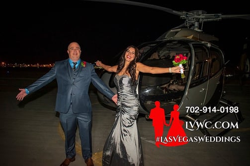 happy wedding couple by helicopter