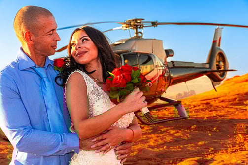 wedding couple by helicopter