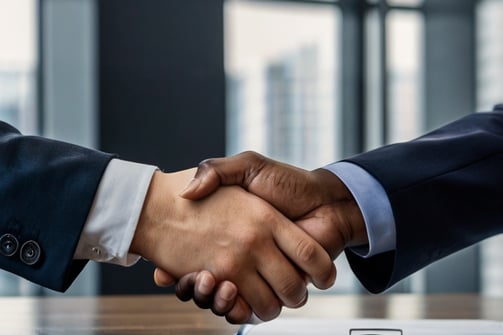 Professional handshake finalizing a successful manufacturing partnership agreement after Weldina's vetting.