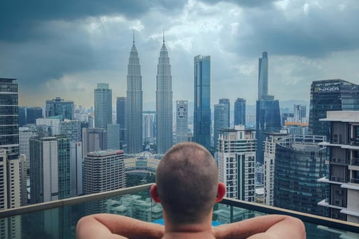 a man in a swimming pool in a city