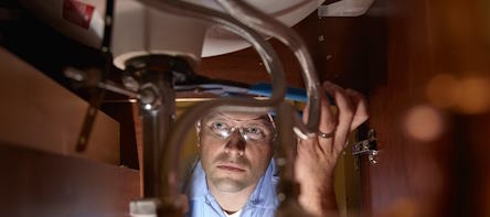 Plumber Inspecting Drain