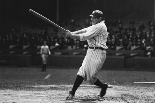 Babe Ruth swinging bat in classic black and white photo