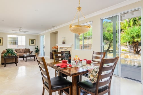 elegant living and dining area with easy access to an entertainer's backyard