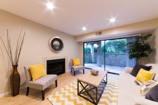 small cozy living room decorated to efficiently utilize space and provide comfort for guests