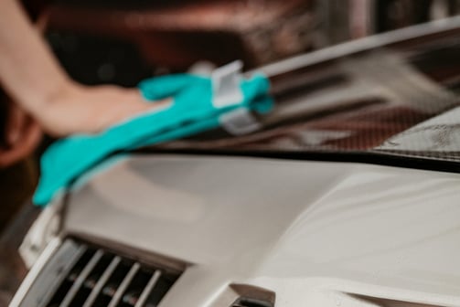 Exterior car detailing with hand wash, wheel and tire care, wax application, bug removal