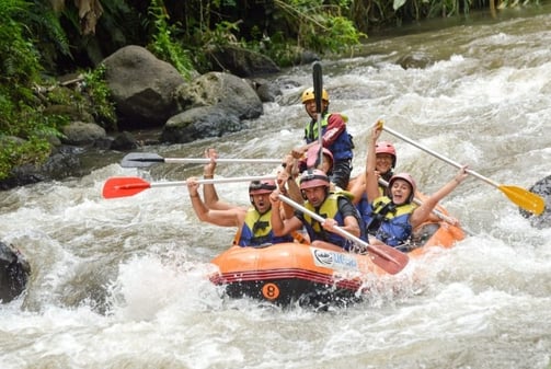 a group of people on raft raft raft rafting down a river