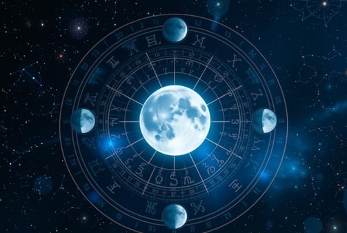 a moon with a blue sky and stars in the background
