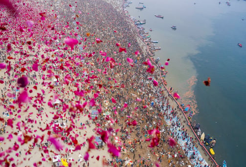 Flower petals being showered on tourists at Maha Kumbh at Prayagraj