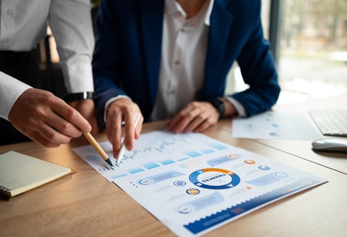 a man and woman working on a business meeting