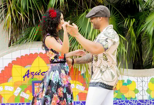 a man and woman dancing in a dance floor