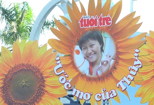 a sign with a picture of a young girl in a sunflower