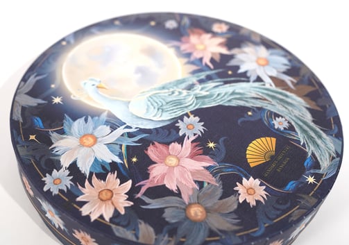 a decorative box with a bird on it