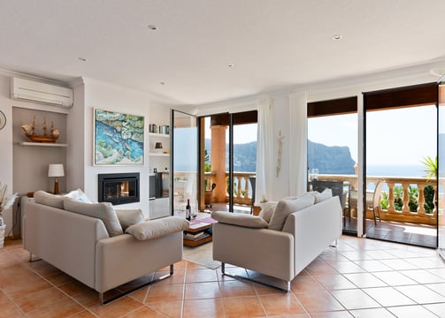 a living room with a fireplace and a fireplace