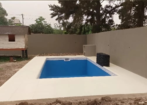 a pool with a blue pool in the middle of the pool