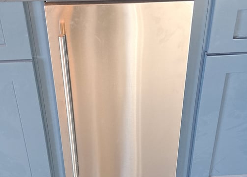 shows beautiful, finished install of an ice maker