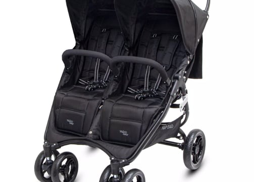 a baby stroller with two strollers