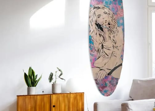 livingroom with Efin surfboard art on wall