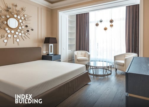 a bedroom with a bed and a mirror