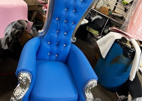 a blue chair with a blue chair and a pink chair