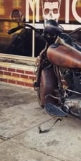 Vintage looking motorcycle in front of window