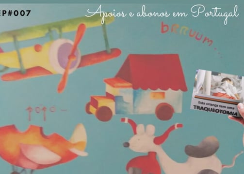 a woman holding a card with a picture of a plane