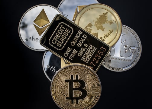 a bunch of bitcoin coins are shown on a black background