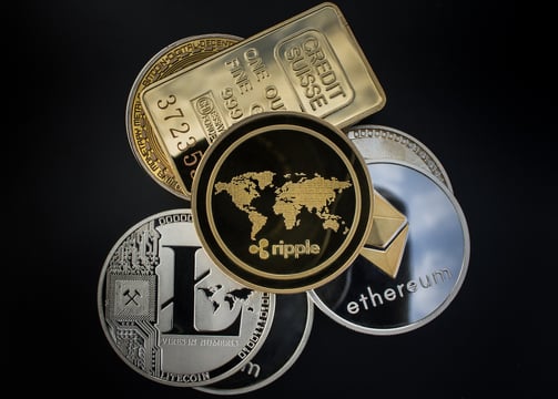 a bunch of coins with a world map on it