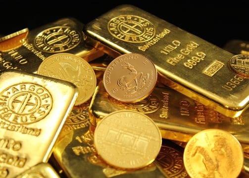 a pile of gold bars with coins and coins