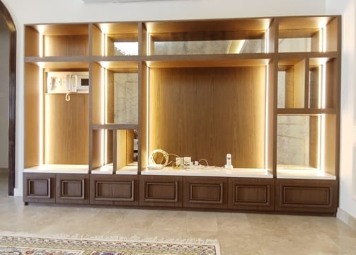 a living room with a large entertainment center