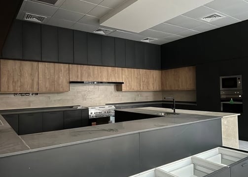 a kitchen with a large counter top and a stove