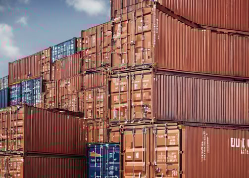 cargo ship on sea under blue sky during daytime