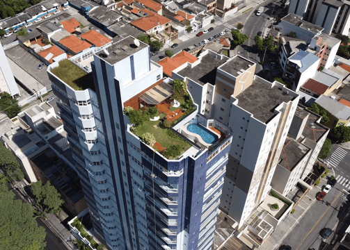 a tall building with a pool in the middle of it