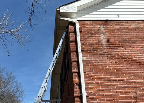 installing seamless k style gutters on a. brick two story home