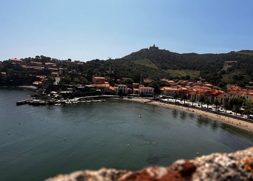 a view of a beach with a view of a town
