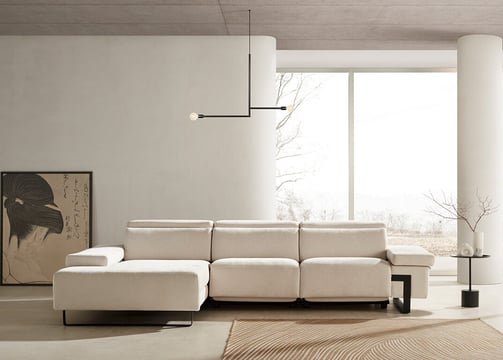 a living room with a couch and a large window
