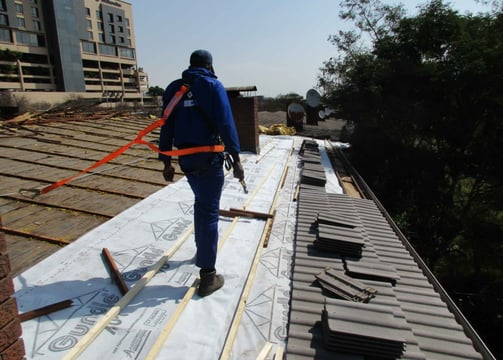 Staff safety harnessed to harness line, safety first, Hyde Park, Sandton