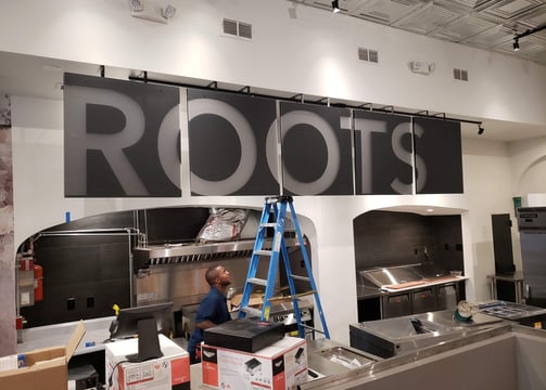 Multi-Panel Second Surface Ceiling Hanging Sign for Roots