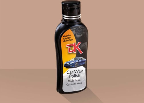 1. A bottle of carnauba wax polish on a brown background, enhancing car paint with high gloss and scratch removal properties.