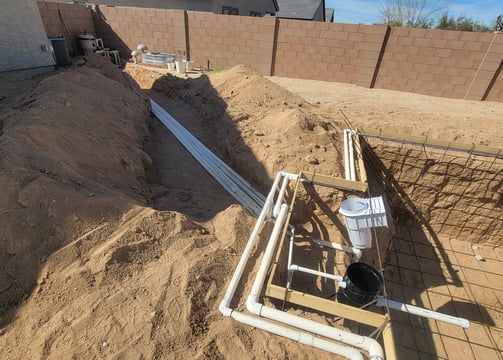 a pipe pipe is shown in the foreground of a house