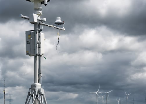a person holding a tennis racket on a tennis court
