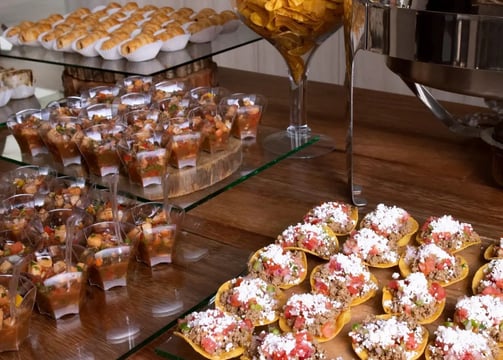 a table with a lot of food and drinks